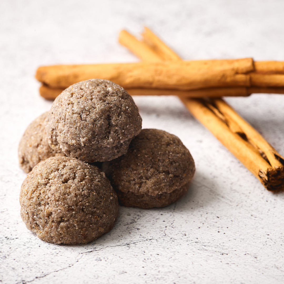 Azulitas sitting on a concrete counter with cinnamon sticks in the background.